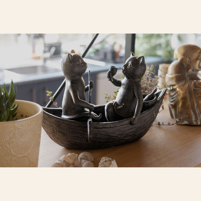 Cats Picnicking on a Boat